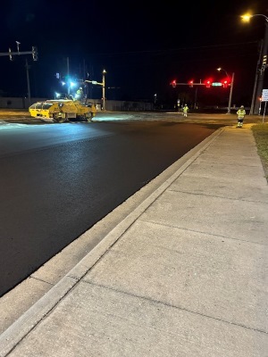 Photo at night of a road that has been resurfaced